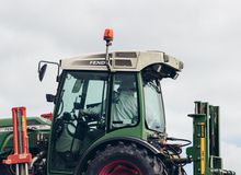 Farmer in a tractor.