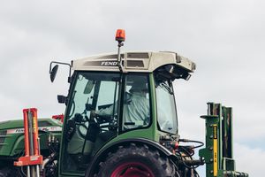 Farmer in a tractor.